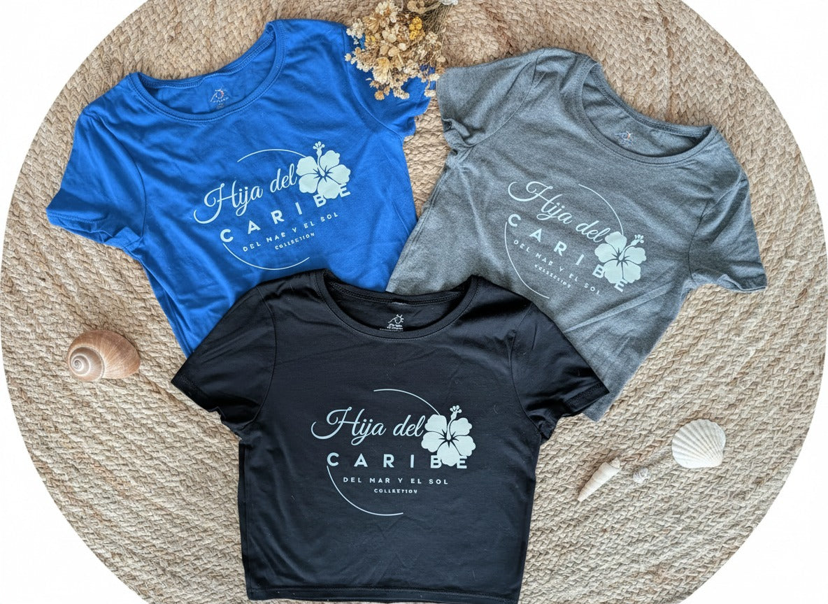 Three t-shirts in blue, black, and gray with a graphic design Hija del Caribe Del Mar y el Sol Collection