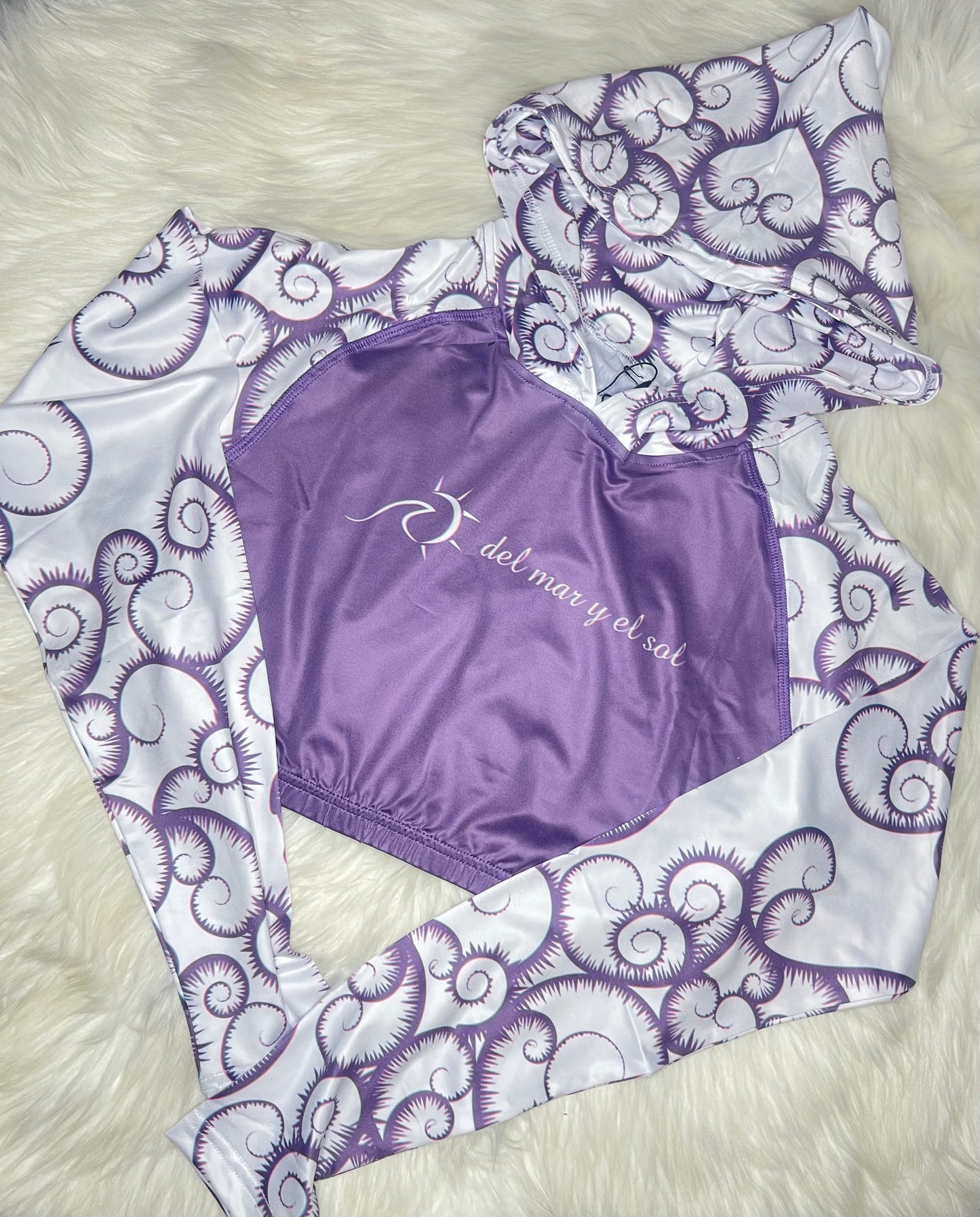 Purple Cropped Rashguard with purple print sleeves. Hoodie and UPF50+
