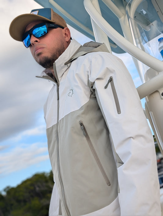 Close-up of waterproof fishing jacket with hood and sealed zippers, perfect for boating and outdoor adventures.