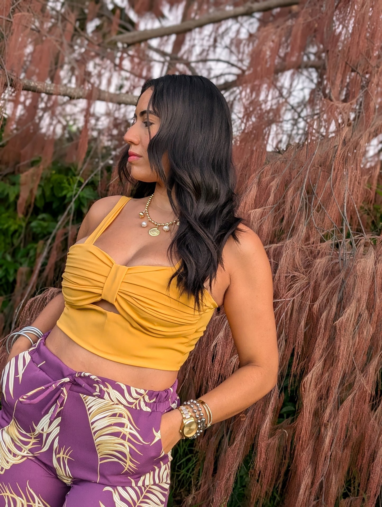 Model wearing Sol Top in mustard color, perfect for pairing with Isla Palm Pants.