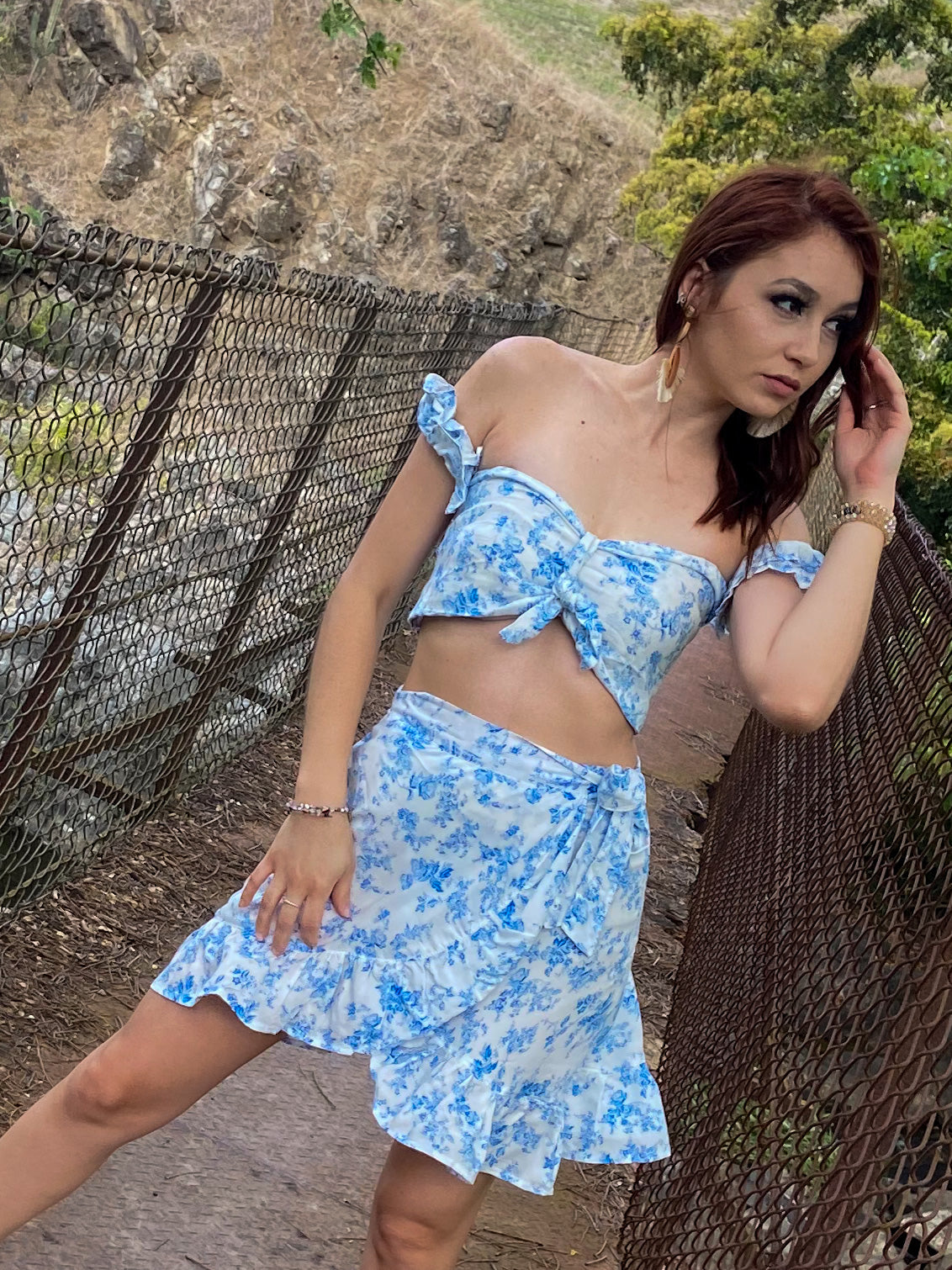 Women’s tropical two-piece skirt set with crop top and adjustable wrap skirt.