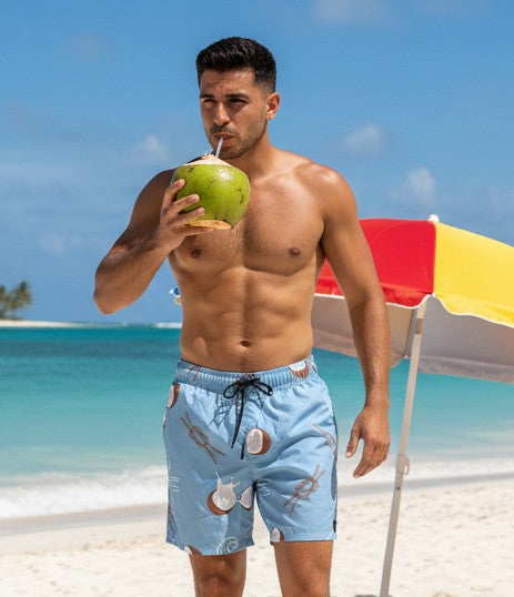 Men’s tropical beach shorts with coconut, ocean wave, and nautical rope print design