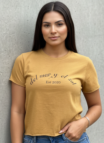 Woman wearing a mustard yellow t-shirt del mar y el sol cropped top