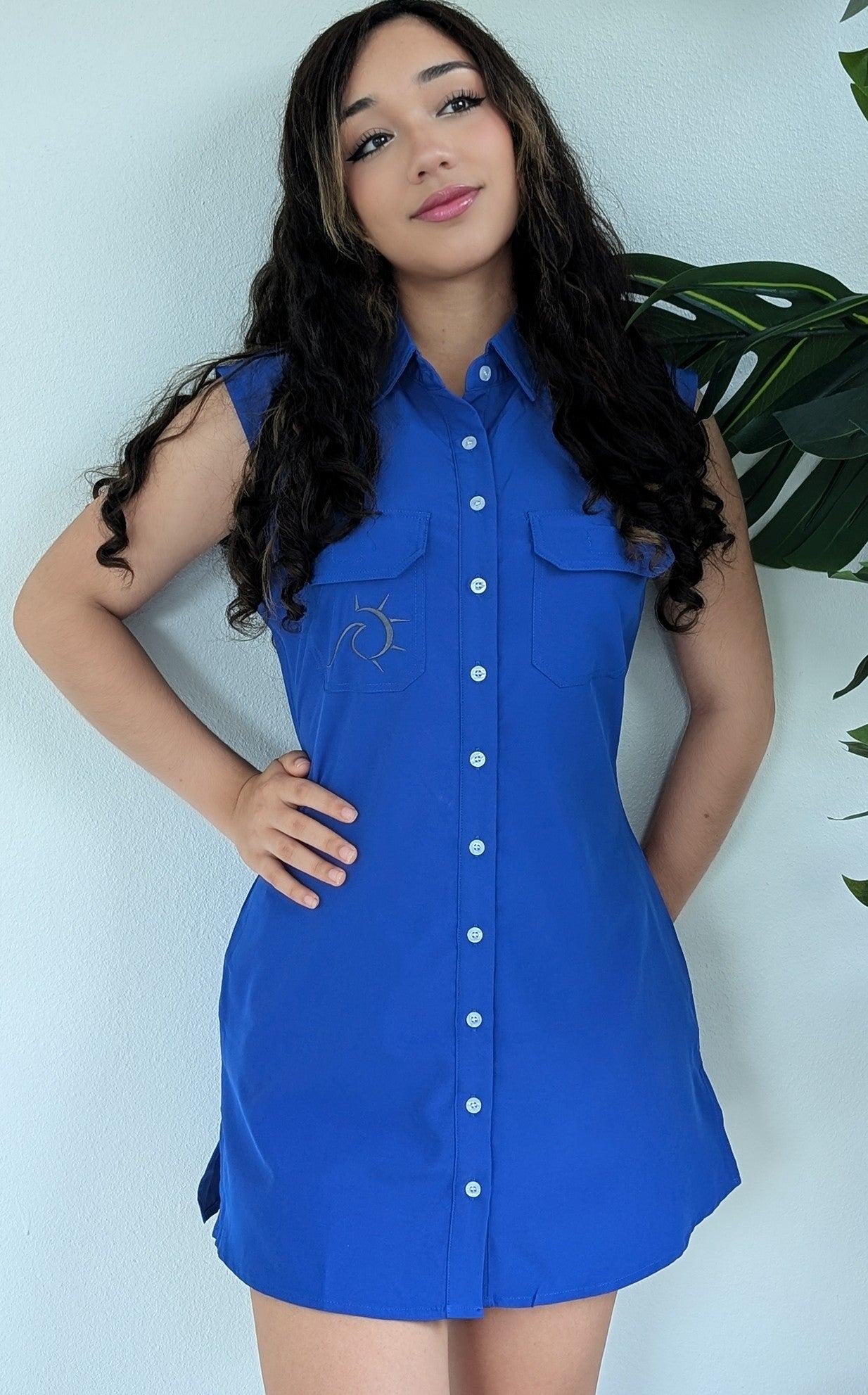 Woman wearing a royal blue quick dry upf50 button up dress