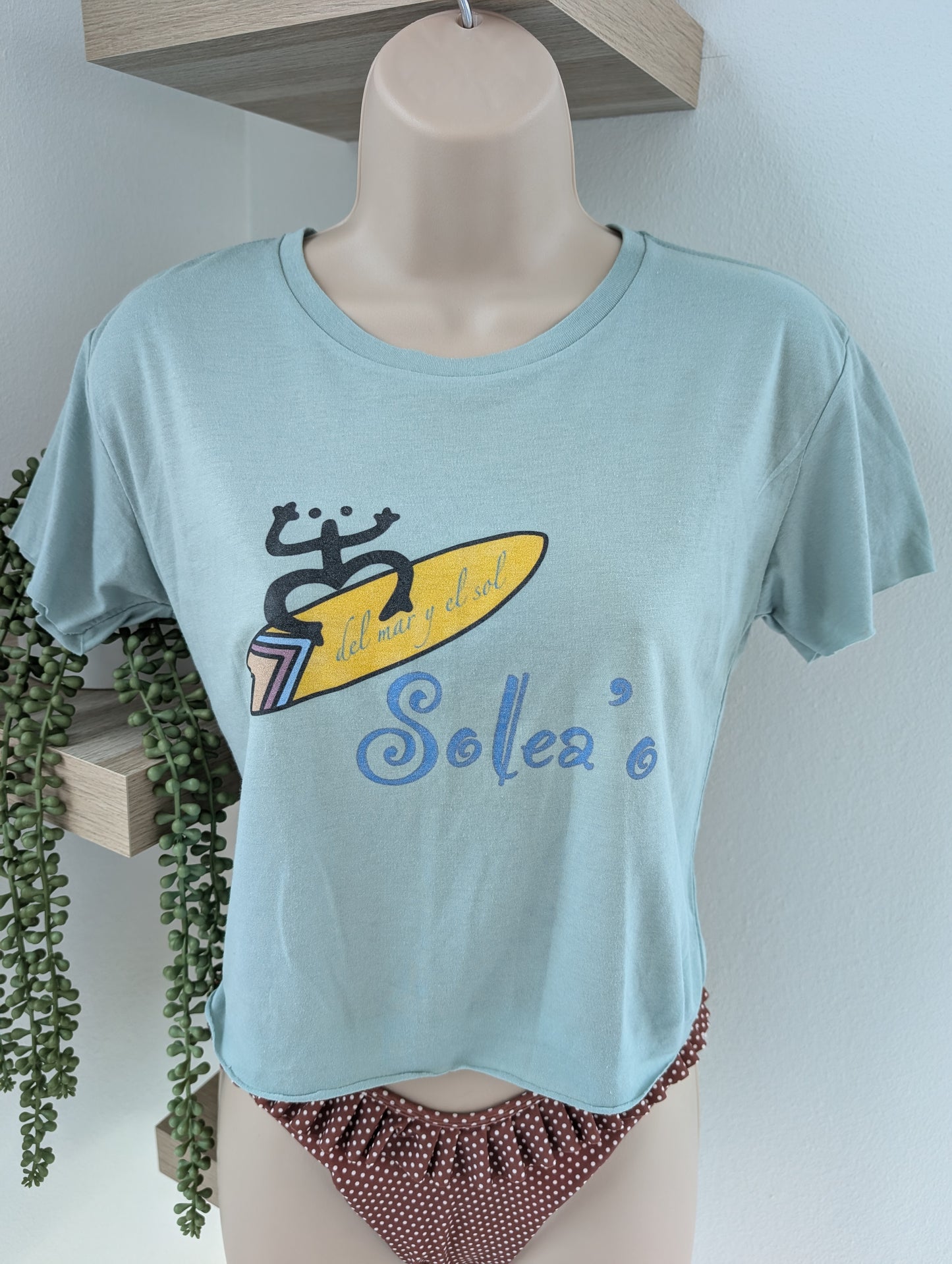 Lightweight loose-fit crop top with Puerto Rico inspired coquí surf graphic print on front