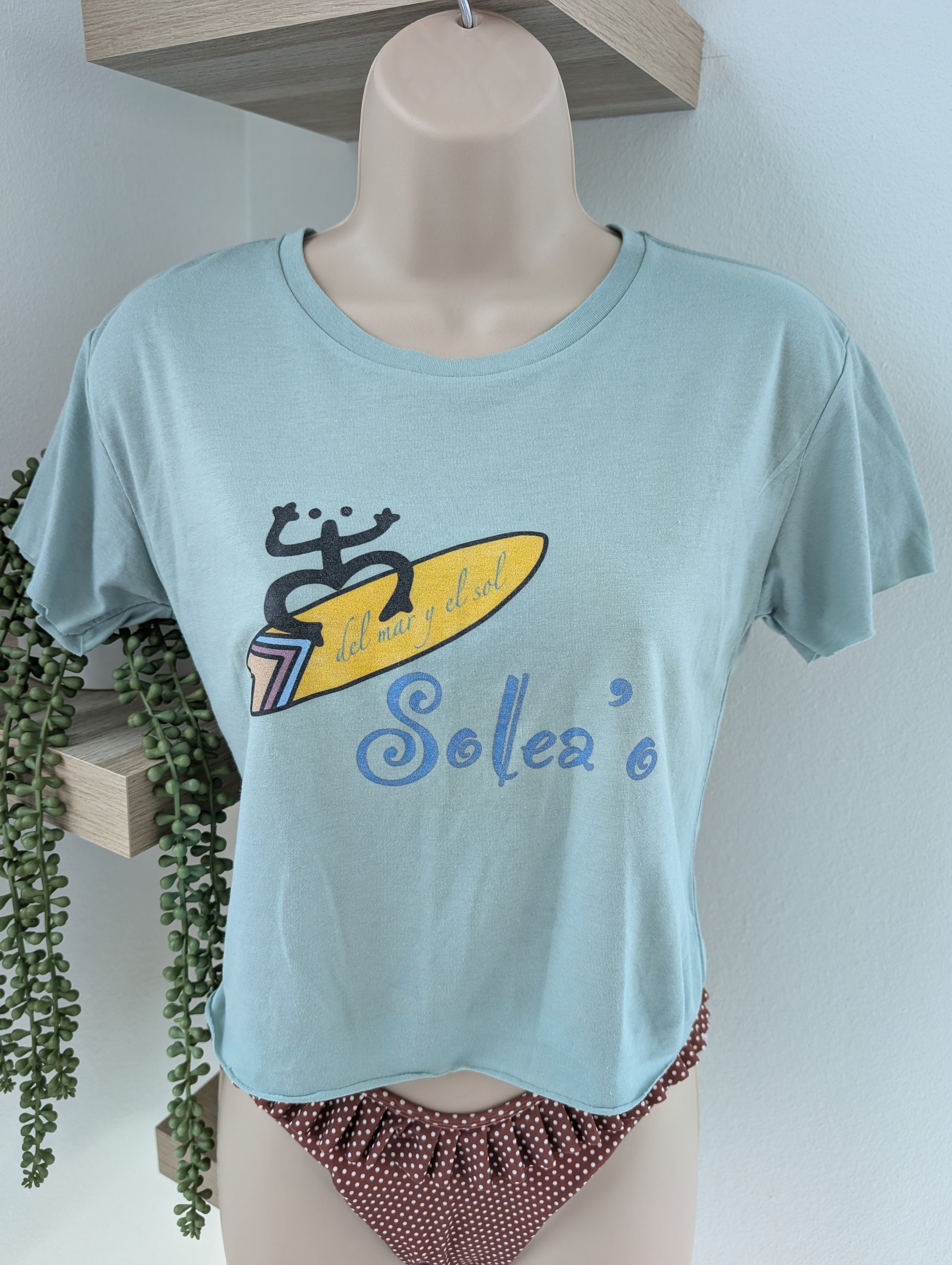 Lightweight loose-fit crop top with Puerto Rico inspired coquí surf graphic print on front