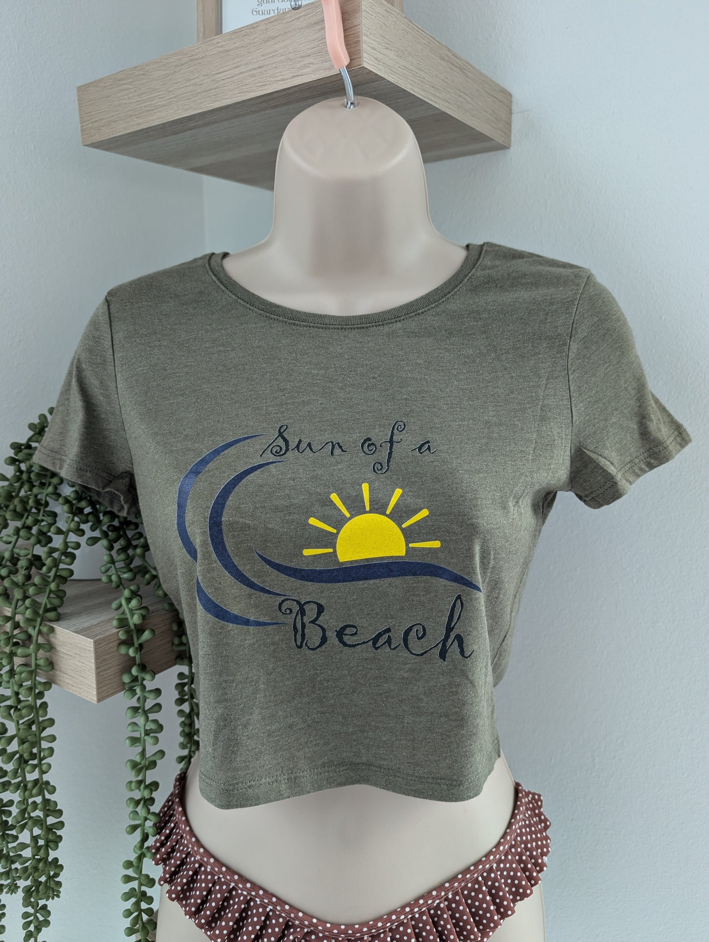 Olive green cropped graphic tee for women with fitted silhouette and coastal beach lifestyle print