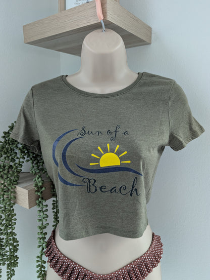 Olive green cropped graphic tee for women with fitted silhouette and coastal beach lifestyle print
