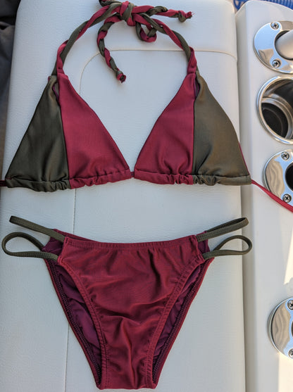 Maroon and olive bikini top with braided straps laid flat