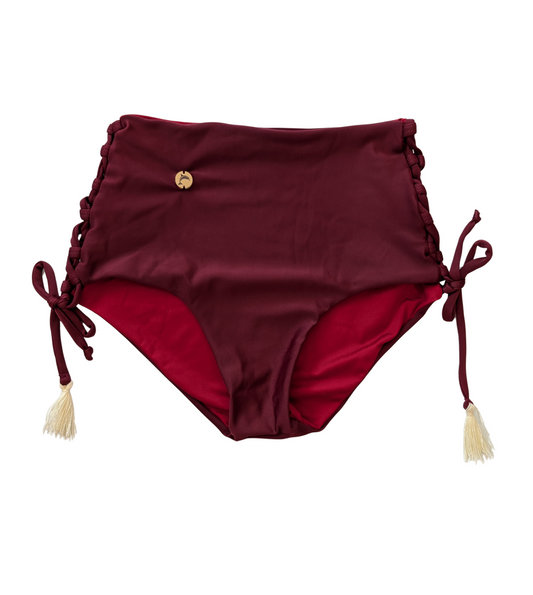High-waisted bikini bottom with lace-up sides and tassel details, handmade swimwear from Del Mar y el Sol